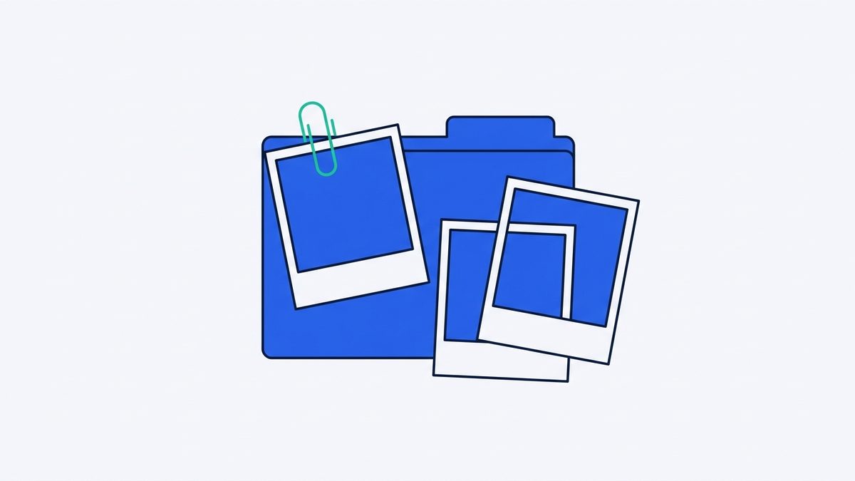 Three instant photo prints, a paperclip, and a paper folder.